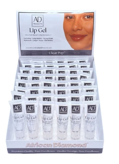 A retail display box filled with small white tubes of AD Products Lip Gel, with a front panel showing the brand name, product name, and a close-up of lips. The display is photographed on a plain white background.