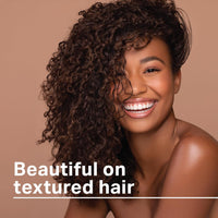 Thumbnail for Woman with curly hair smiling against a brown background with text 'Beautiful on textured hair'.