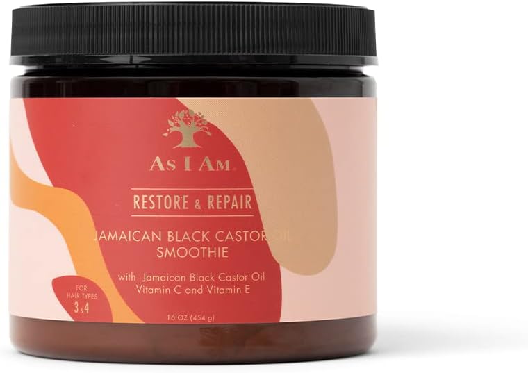 A jar of As I Am Restore & Repair Jamaican Black Castor Oil Smoothie on a white background. The product is in a dark amber-brown jar with a black lid and a label featuring red, orange, and beige abstract shapes.