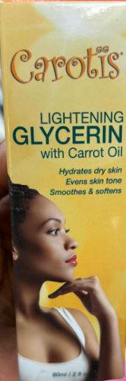 Thumbnail for Carotis Lightening Glycerin with Carrot Oil product packaging featuring a model on a yellow 
CAROTIS Lightening Glycerin with Carrot Oil (60ml)background.
Carotis glycerin, carrot oil moisturizer, skin lightening glycerin, brightening skin oil, hydrating carrot oil, 60ml glycerin, natural skin brightener