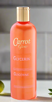 Thumbnail for A bottle of Carrot Glow Glycerin in a translucent orange bottle with a gold cap, set against a soft gray background.