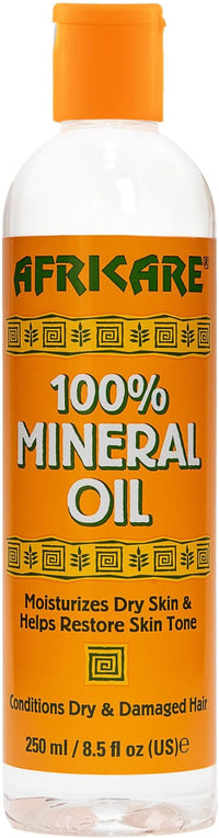 Thumbnail for AFRICARE 100% Mineral Oil bottle with orange cap and label
