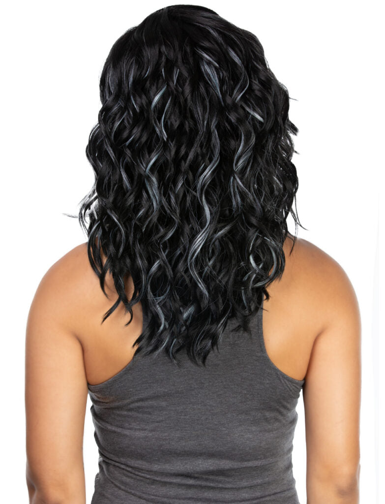 Person wearing a black wavy wig on a white background