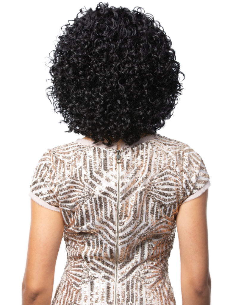 Person wearing a patterned top with a focus on the back of the head showing black hair.