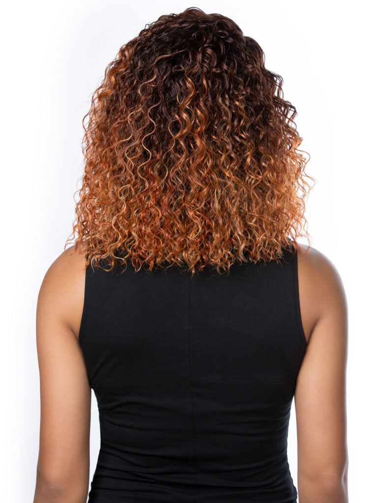 Person with curly hair wearing a black sleeveless top on a white background