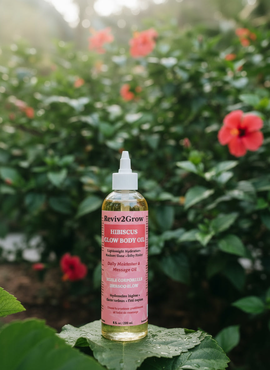 Bottle of Reviv2Grow Hibiscus Glow Body Oil on a light background