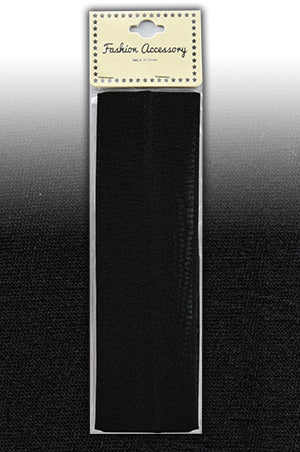 Black hair tie in packaging with 'Fashion Accessory' label on a reflective surface.