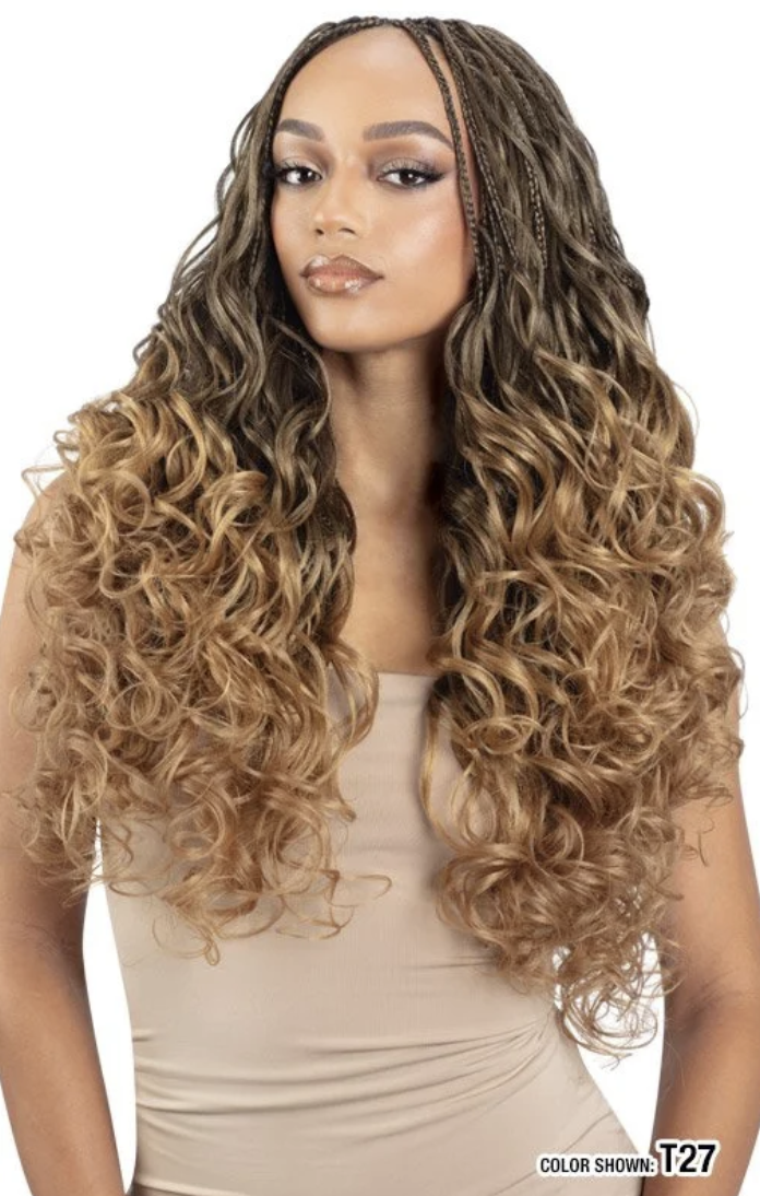 Woman with long, wavy hair styled in loose curls on a white background