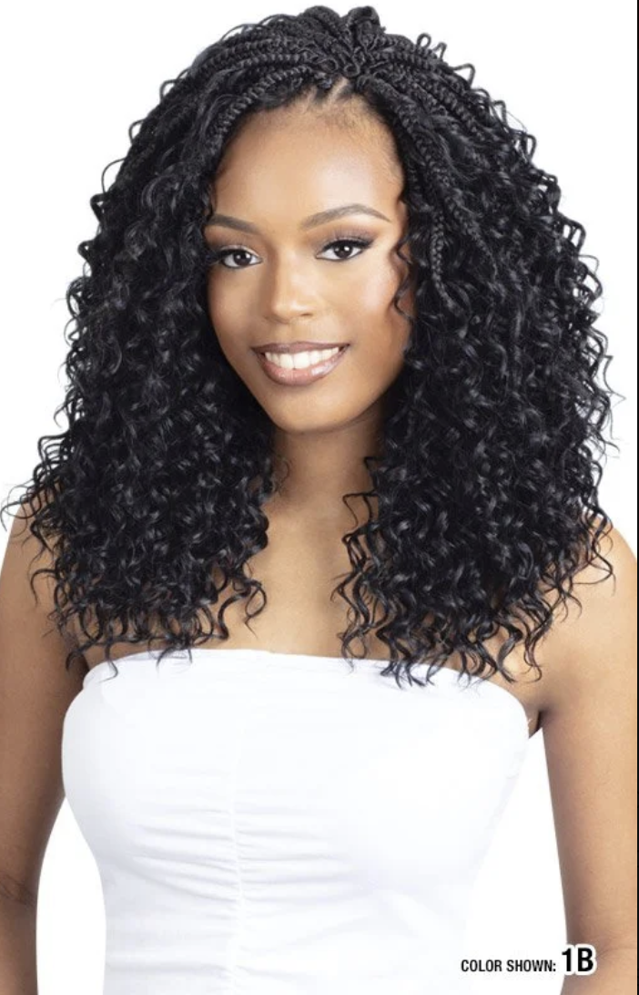 Woman with styled hair wearing a white top on a white background