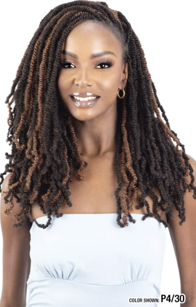 A woman modeling a shoulder-length box braided wig with dark brown and warm brown highlights, styled in a straight, voluminous box-braided look against a plain white background.