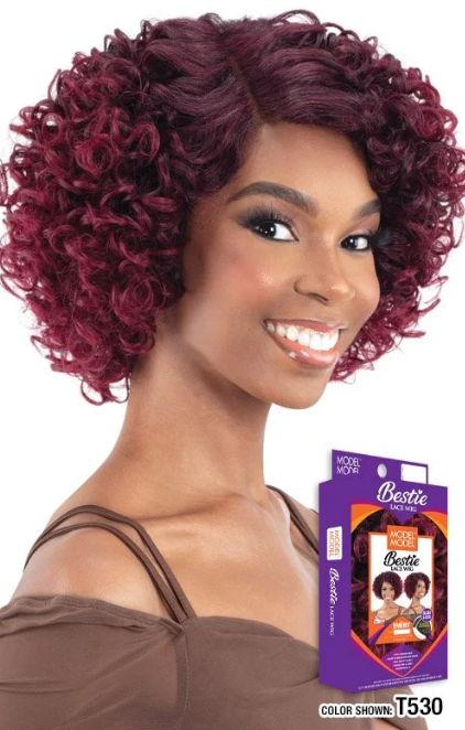 Woman with styled hair and a wig box labeled 'Bestie' on a white background