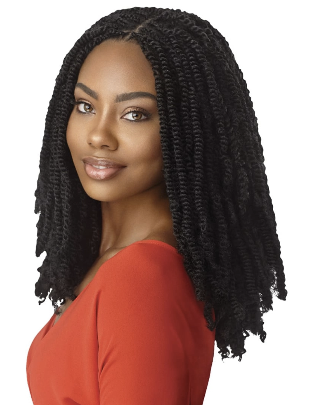 Woman with styled black hair wearing an orange top on a white background