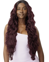 Thumbnail for A woman modeling a long, wavy wig with deep burgundy and auburn tones, styled with a center part and full volume, against a plain white background.