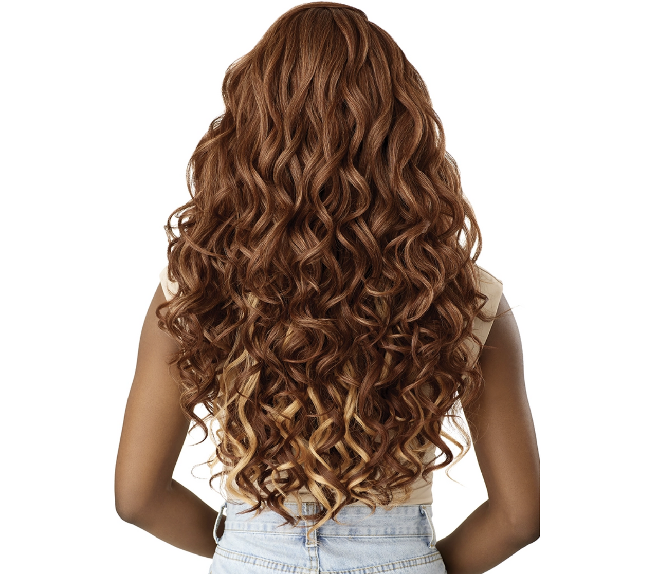 A woman shown from the back wearing a long, wavy wig with a warm medium brown root and caramel highlights, paired with a beige top and light denim shorts against a solid white background.