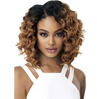 Thumbnail for A woman modeling a short, curly wig with dark roots and warm caramel-to-brown highlights, paired with a white sleeveless top against a plain white background.