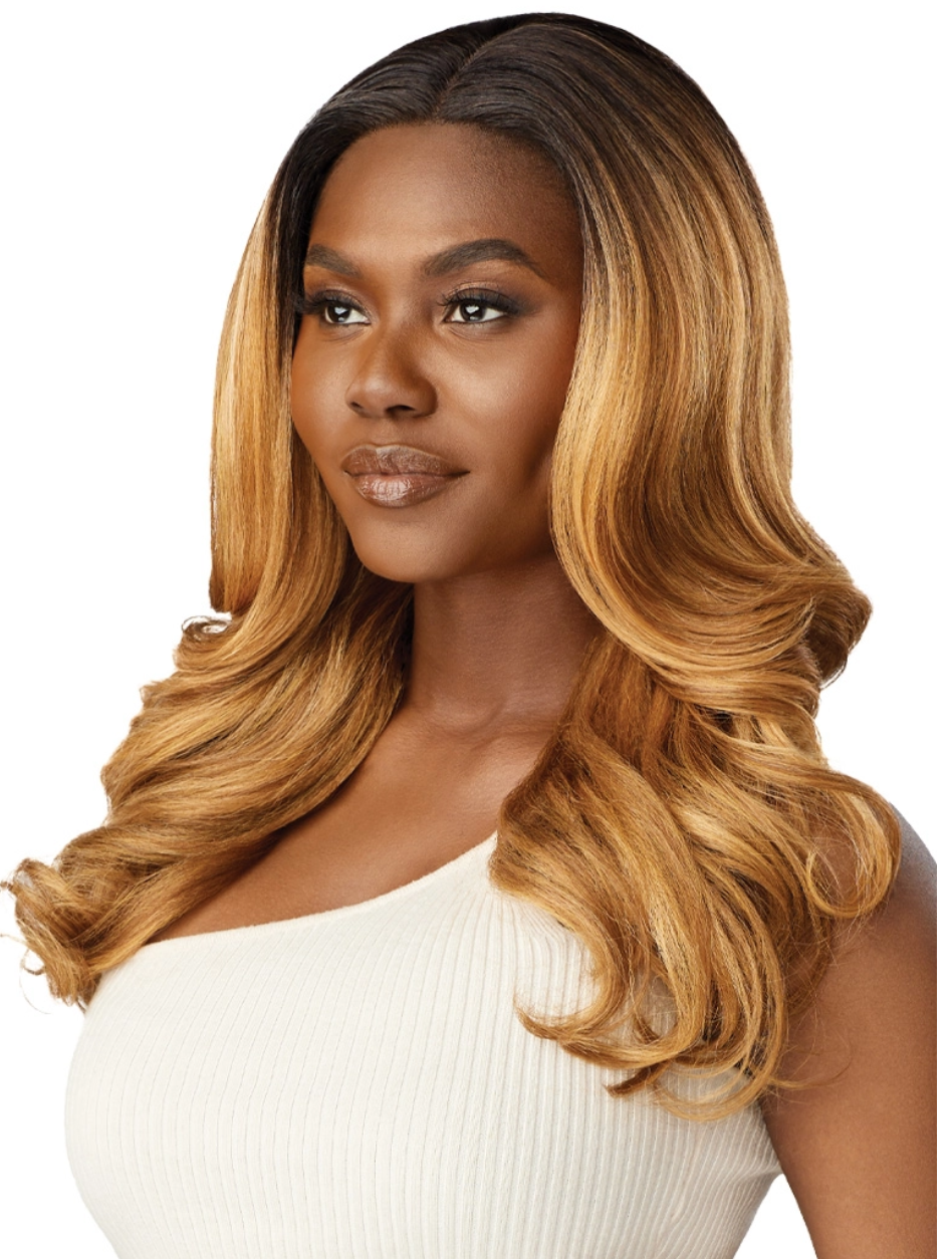 Woman with long, wavy, blonde hair on a white background