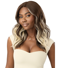 Thumbnail for Woman with wavy hair transitioning from brown to blonde, wearing a beige top on a white background.