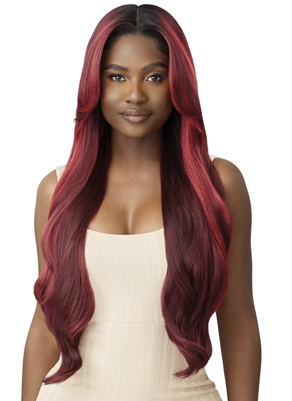 Woman with long, wavy hair transitioning from black to red on a white background