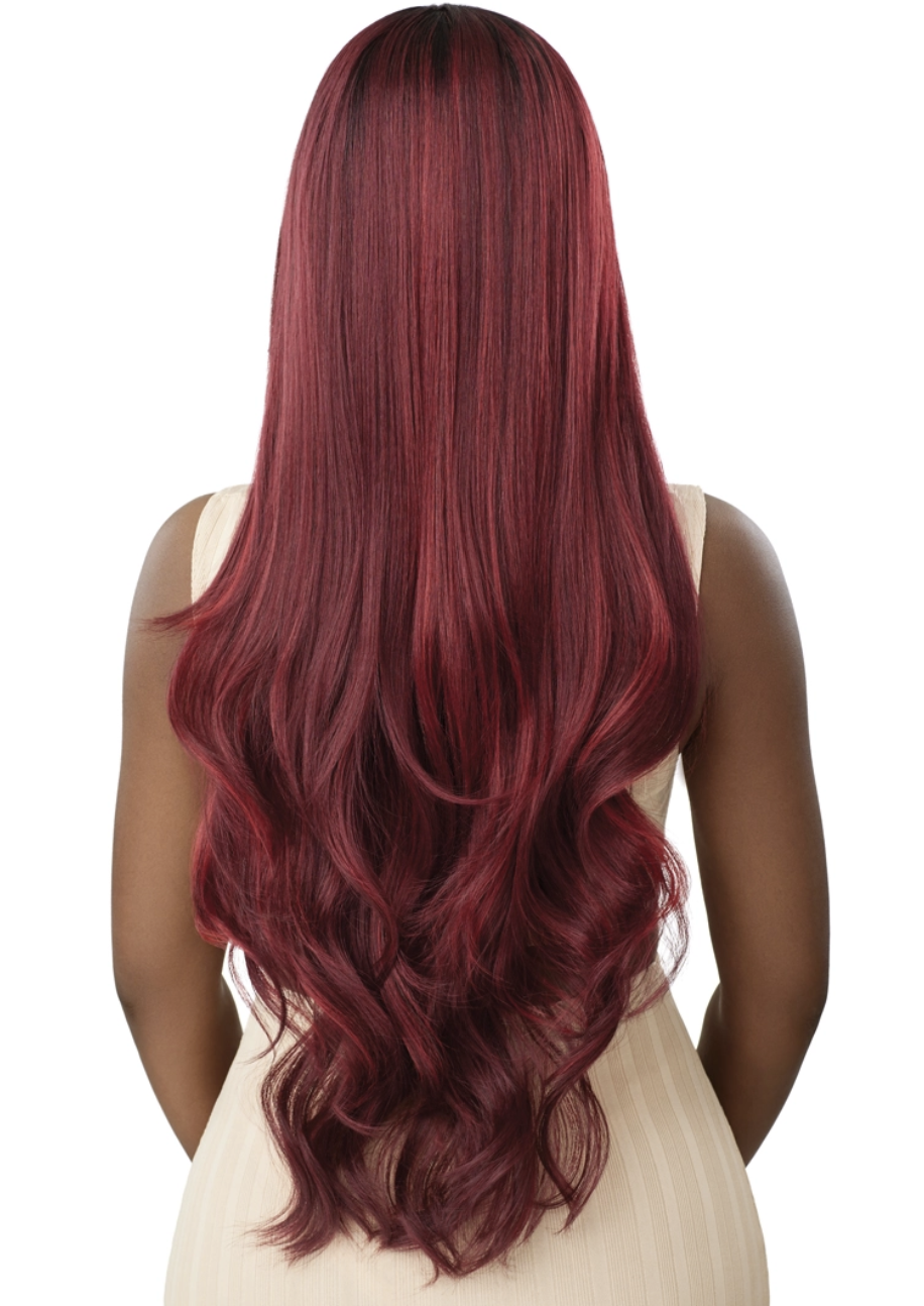Woman with long, wavy, burgundy hair on a white background