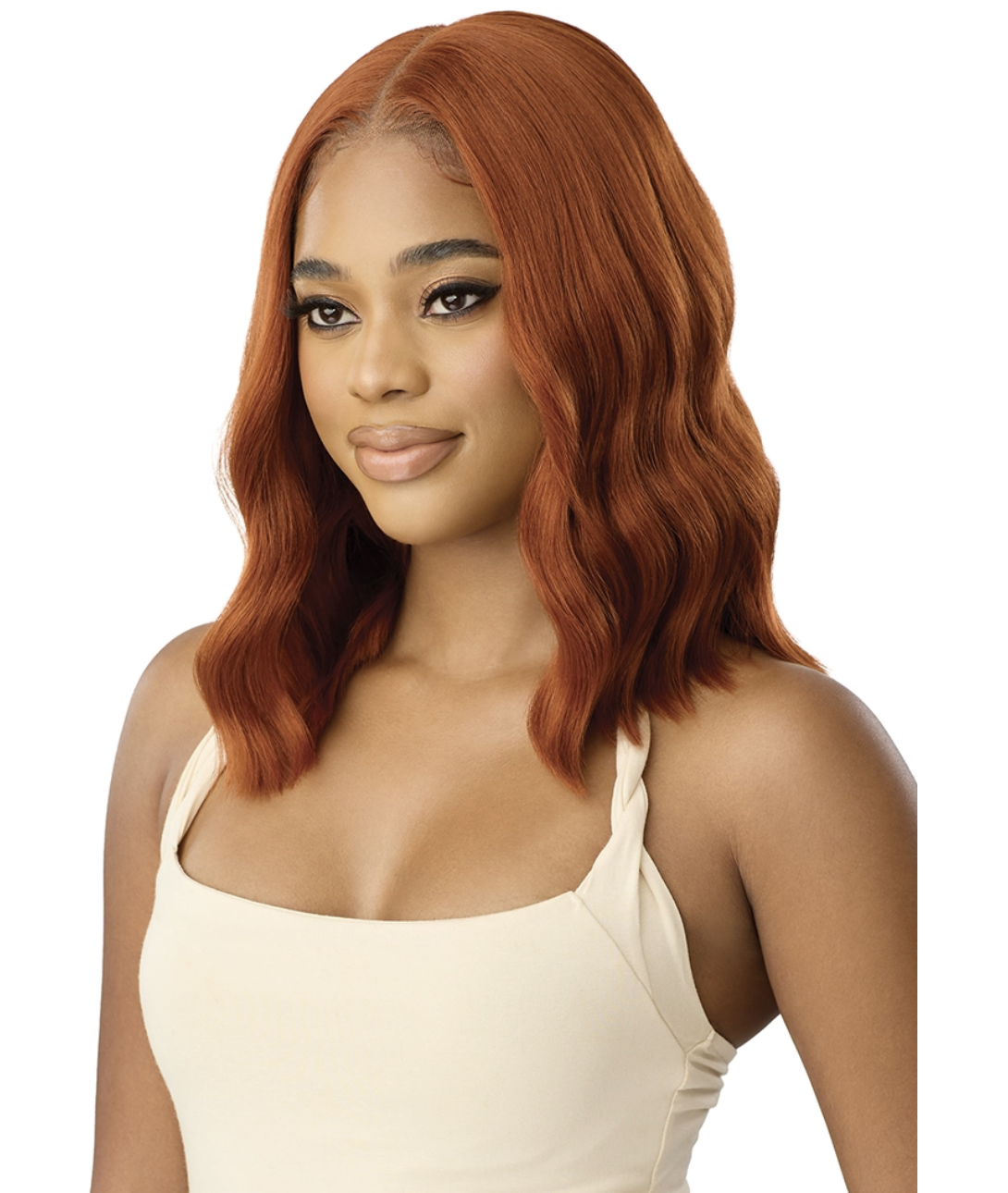 Woman with styled red hair wearing a beige top on a white background