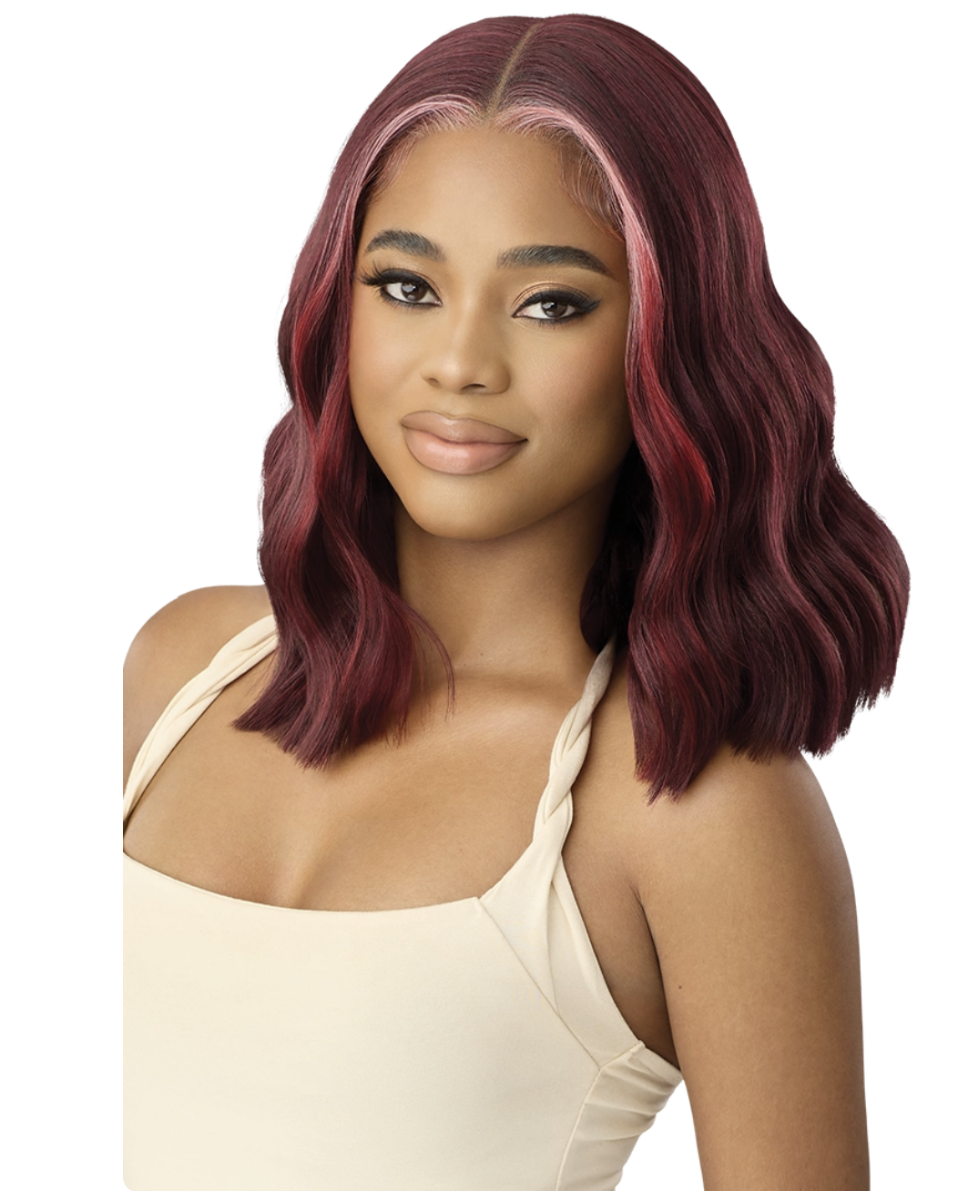 Woman with burgundy hair styled in a bob, wearing a beige top on a white background