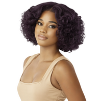 Thumbnail for A woman modeling a short, curly wig with deep dark purple color, paired with a beige ribbed tank top, set against a solid white background.