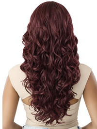 Thumbnail for Woman with long, wavy, burgundy hair on a white background