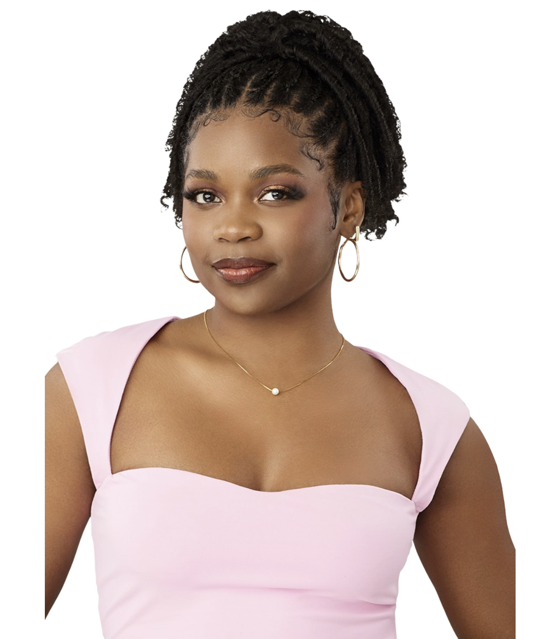 A woman with braided hair wearing a light pink strapless top, gold hoop earrings, and a delicate necklace, shown against a plain white background.
