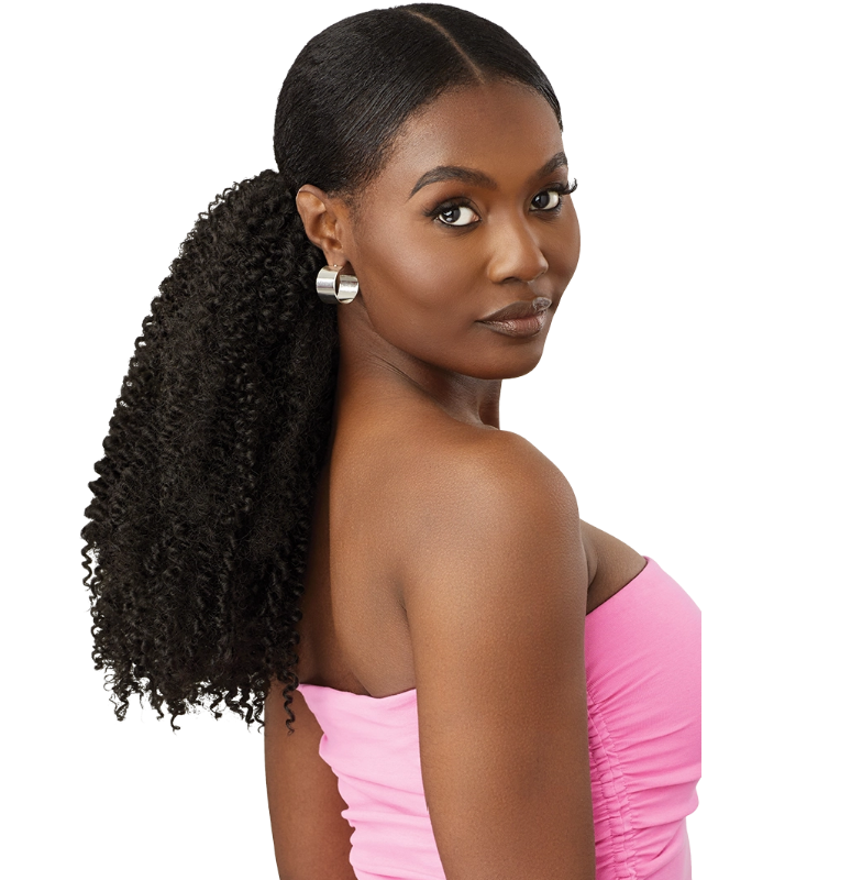 Woman with styled hair in a ponytail wearing a pink top on a white background