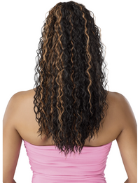 Thumbnail for Woman with long, curly hair wearing a pink top on a white background
