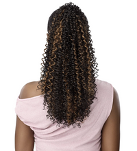 Thumbnail for A person shown from the back wearing a long, curly wig with dark brown to black curls and warm caramel-brown highlights, paired with a light pink off-the-shoulder top against a plain white background.