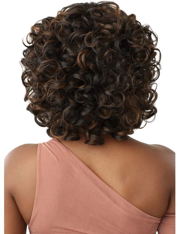 Curly hair bun styled on a person wearing a pink top against a white background