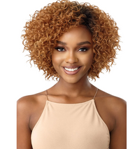 Thumbnail for Woman with styled hair wearing a beige top on a white background