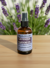 Thumbnail for Bottle of Reviv2Grow Lavender Castor Oil on a wooden surface with a white background