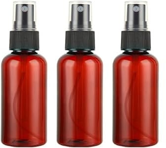 Three empty amber red spray bottles with black spray nozzles, arranged side by side on a white background.