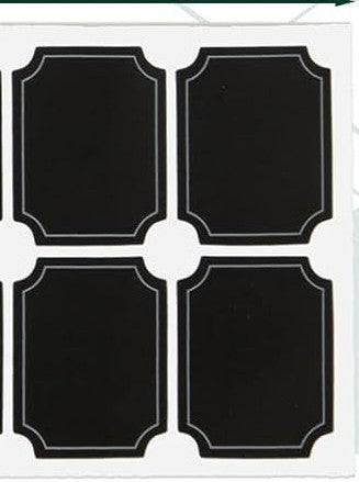 Four black decorative label stickers with white border lines, arranged in a 2x2 grid on a white backing sheet.