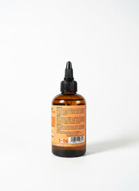 Thumbnail for Brown bottle with a label on a gray surface