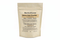 Thumbnail for Reviv2Grow Detox Hair Powder package on a white surface with a blurred background