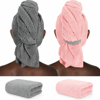 Thumbnail for Gray and pink textured towel wraps on a person with additional towels shown below.