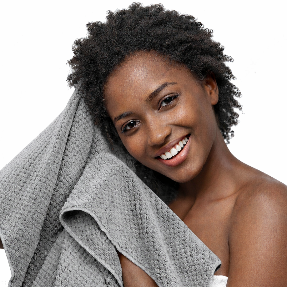 Woman with a gray towel draped over her shoulder on a white background