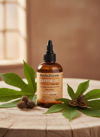 Thumbnail for Reviv2Grow castor oil bottle with leaves and seeds on a wooden surface
