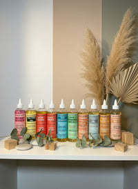 Thumbnail for Row of colorful bottles with caps on a gray surface