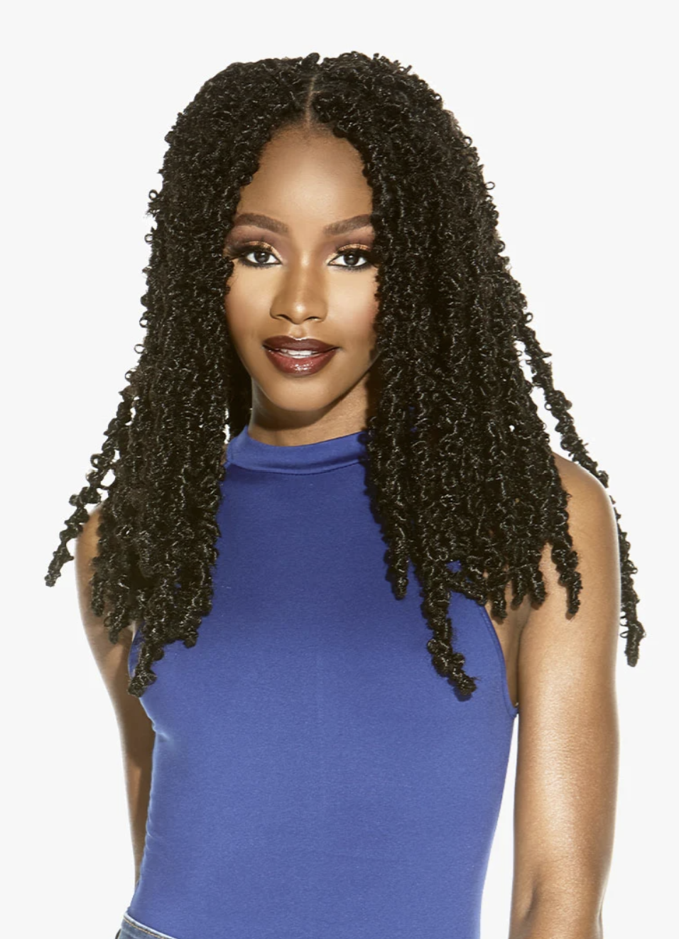 Woman with long, styled braids wearing a blue top against a white background