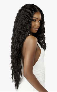 Thumbnail for Woman with long, wavy black hair wearing a white top on a white background