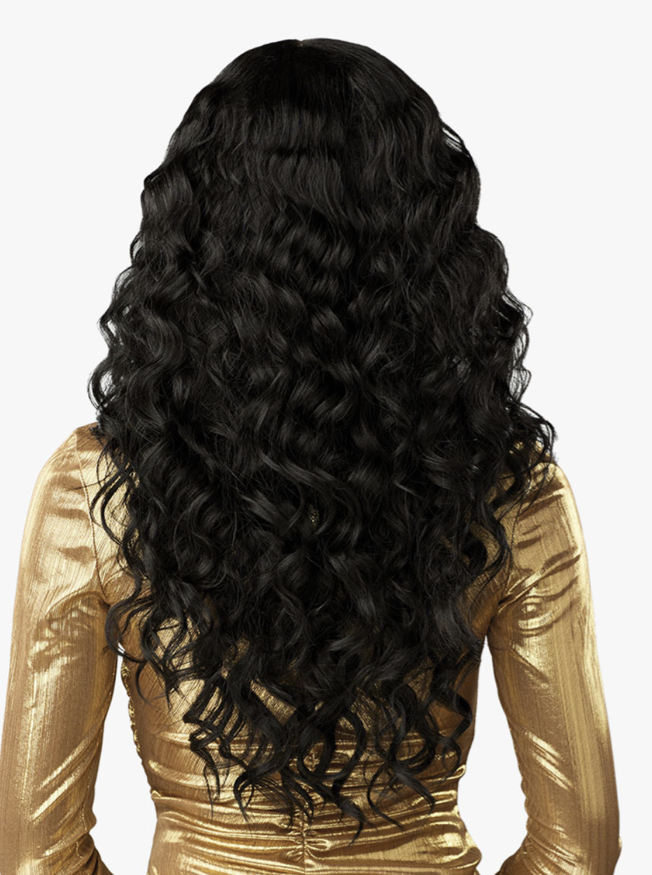 Woman with long, wavy black hair wearing a gold top on a white background