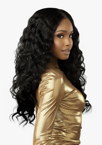 Thumbnail for Woman with long, wavy black hair wearing a gold top on a white background