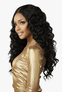Thumbnail for Woman with long, wavy black hair wearing a gold top on a white background
