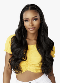Thumbnail for Woman with long, styled hair wearing a yellow top against a white background