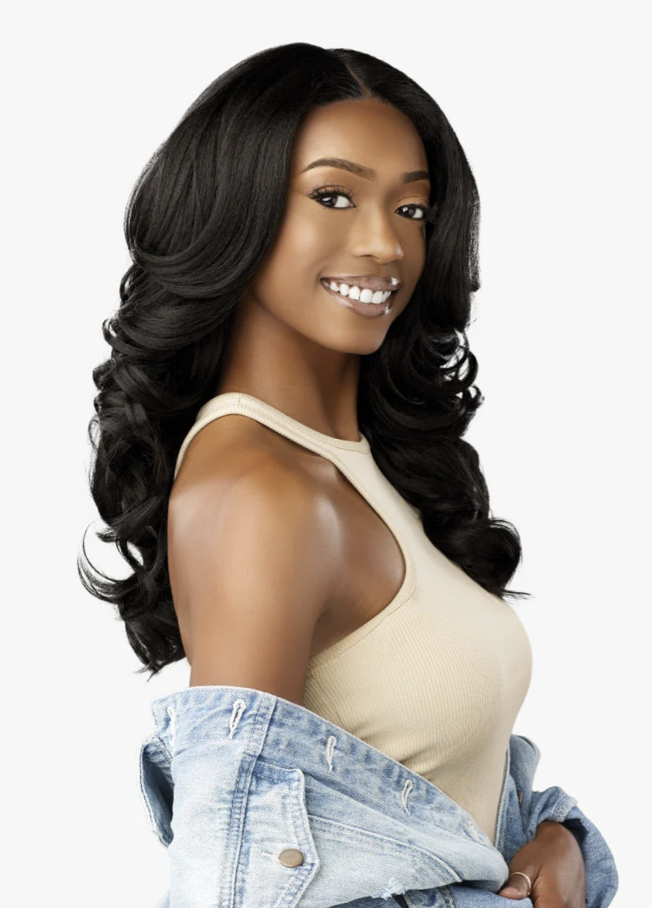 Woman with long, wavy black hair wearing a beige top and denim jacket on a white background