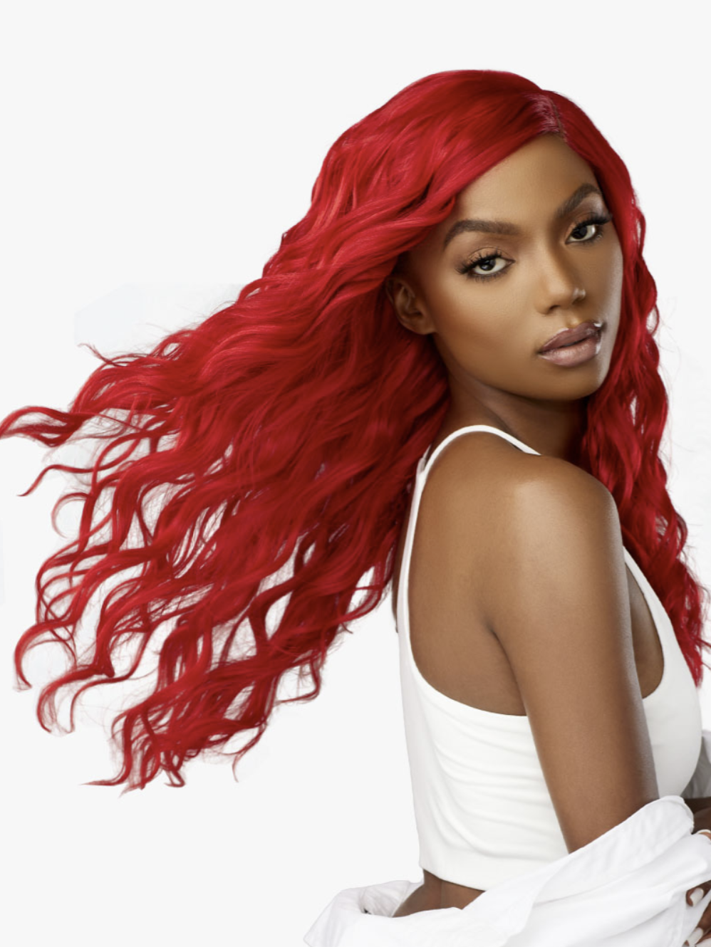 Woman with vibrant red hair wearing a white top on a white background